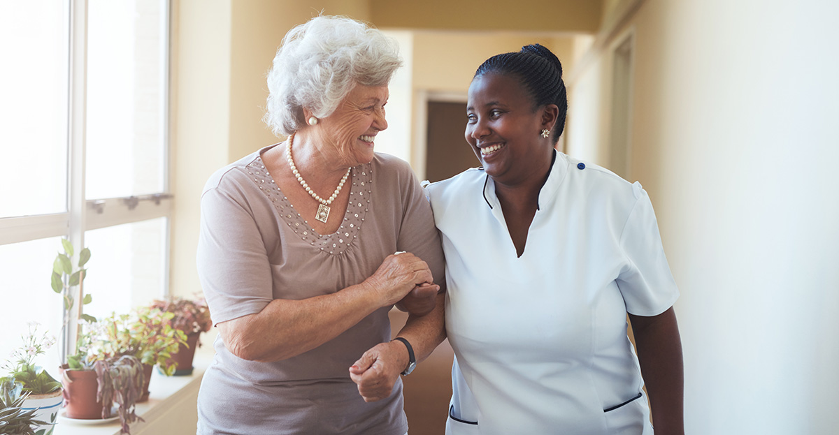 Senior and caretaker talking