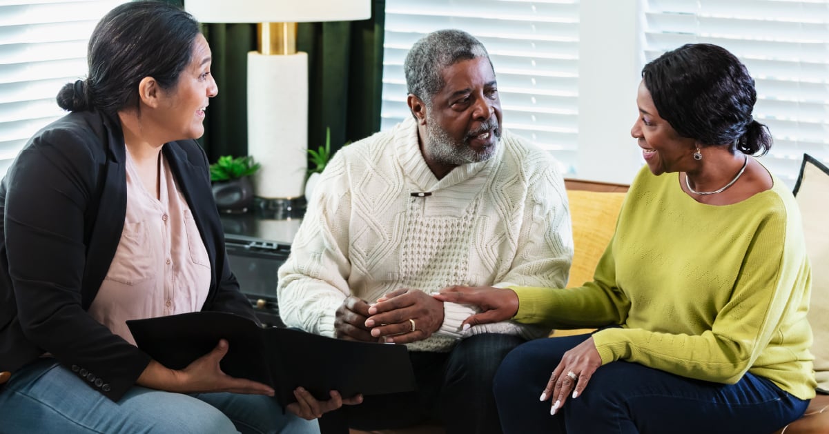 family talking with senior about moving into assisted living