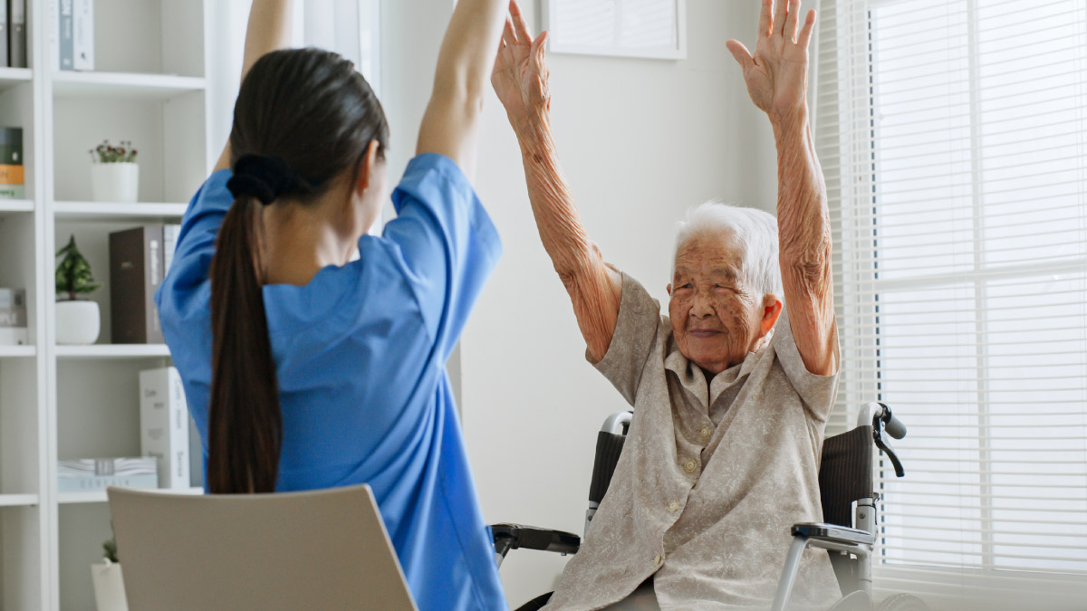 Physical therapist working with an older adult