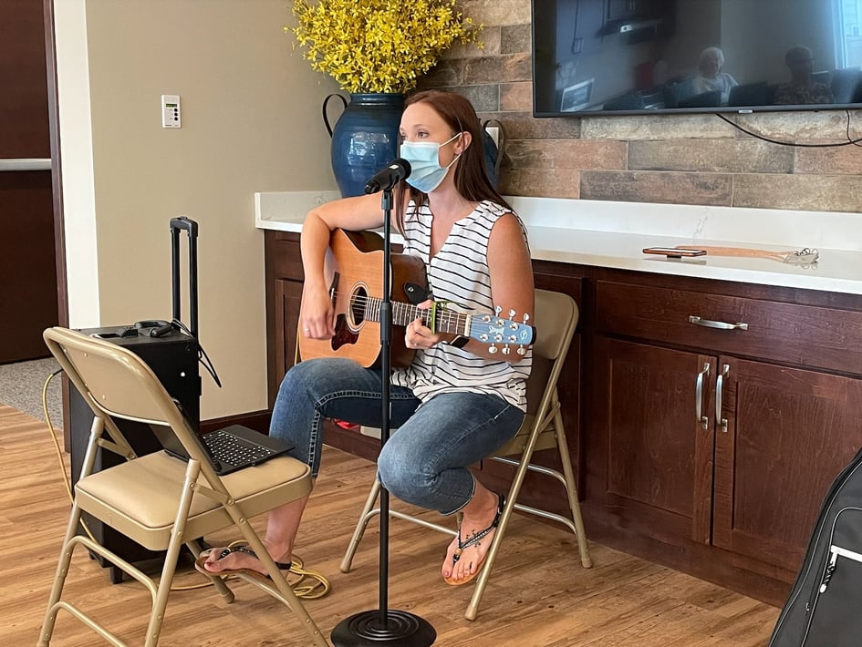 Hannah playing guitar