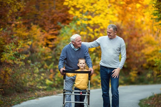 great grandfather walking on trail with son and great grandson