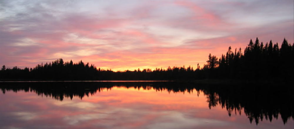 sun setting over a lake