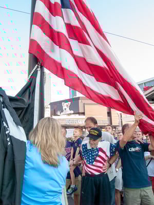 Holding the flag up